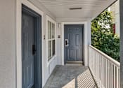 Thumbnail 3 of 22 - the front door of a house with blue doors and a porch