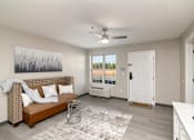 Thumbnail 1 of 22 - an open living room with a couch and a ceiling fan