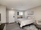 Thumbnail 13 of 22 - a bedroom with a bed and a tv