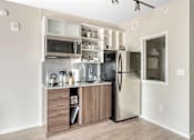 Thumbnail 19 of 49 - A kitchen with a refrigerator, microwave, and oven.at Sky Central, Cincinnati