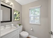 Thumbnail 13 of 54 - a bathroom with a toilet and a sink and a window at Indian Creek Apartments*, Ohio, 45236