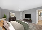 Thumbnail 11 of 54 - a bedroom with a large bed and a tv at Indian Creek Apartments*, Cincinnati, OH