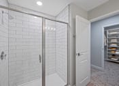 Thumbnail 28 of 54 - a white bathroom with a shower and a closet at Indian Creek Apartments*, Ohio, 45236