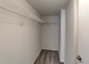 Thumbnail 40 of 46 - Walk in closet in an empty room with white walls and a white closet rack at Gramercy on Garfield, Cincinnati, 45202