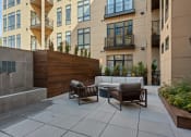 Thumbnail 73 of 81 - an outdoor patio with couches and chairs in front of an apartment building at Four23/Hoge, Ohio, 45226