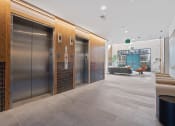 Thumbnail 44 of 81 - a lobby with elevators and a seating area and a staircase at Four23/Hoge, Ohio