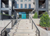 Thumbnail 75 of 81 - the entrance to a building with stairs and a blue door at Four23/Hoge, Ohio