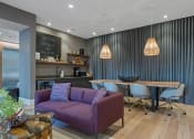 Thumbnail 46 of 81 - a living room and dining room with purple couch and chairs and a table and chairs at Four23/Hoge, Cincinnati, OH, 45226