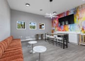 Thumbnail 54 of 57 - a living room with a couch and a table with chairs at Indian Lookout Apartments, Ohio, 45449