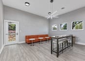 Thumbnail 56 of 57 - a room with a bar and a couch and a table at Indian Lookout Apartments, West Carrollton, OH