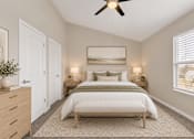 Thumbnail 18 of 40 - A bedroom with a bed, nightstands, and a ceiling fan.