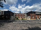 Thumbnail 46 of 46 - an empty parking lot in front of a brick building  at Cincinnati Premier Living*, Cincinnati, Ohio