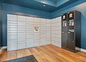 Thumbnail 53 of 64 - A room with a row of lockers and a vending machine.