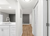 Thumbnail 23 of 51 - A modern kitchen with white cabinets and a wooden floor.at Crooked Creek, Indianapolis Indiana
