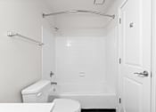 Thumbnail 41 of 51 - A white bathroom with a toilet, sink, and bathtub.at Crooked Creek, Indianapolis