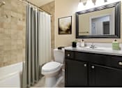 Thumbnail 10 of 32 - a bathroom with a shower and a toilet and a sink at Olde Towne in Kenwood, Cincinnati, 45243