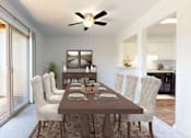 Thumbnail 2 of 35 - a dining room with a wooden table and chairs and a ceiling fan at Lawrence Landing, Indianapolis, IN 46226
