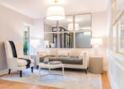 Thumbnail 32 of 54 - a living room with a couch and two chairs and a mirror at Indian Creek Apartments*, Ohio, 45236