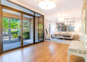 Thumbnail 29 of 54 - a living room with sliding glass doors to a patio at Indian Creek Apartments*, Ohio