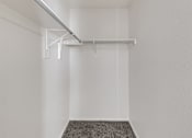 Thumbnail 16 of 27 - A white room with a grey carpet and a white ceiling.