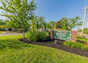 Thumbnail 27 of 27 - A sign for Elmwood Estates is in front of a green lawn.