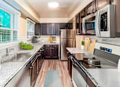 Thumbnail 1 of 32 - a kitchen with stainless steel appliances and marble counter tops at Olde Towne in Kenwood, Ohio, 45243
