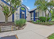 Thumbnail 37 of 38 - The front of a building with a sign that says "Crestview Academy".