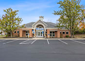 Thumbnail 37 of 57 - the front of a brick building with a parking lot at Indian Lookout Apartments, Ohio, 45449