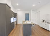 Thumbnail 13 of 81 - Kitchen with white walls and a wooden floor at Four23/Hoge, Cincinnati, 45226 at Four23/Hoge, Ohio