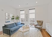 Thumbnail 11 of 81 - Living room with white walls and hardwood floors at Four23/Hoge, Ohio, 45226
