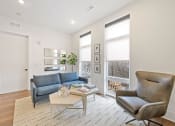 Thumbnail 10 of 81 - Living room with white walls and hardwood floors at Four23/Hoge, Ohio