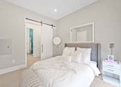 Thumbnail 18 of 81 - Bedroom with a large bed and white walls at Four23/Hoge, Cincinnati, OH