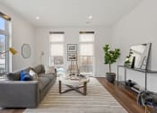 Thumbnail 27 of 81 - Living room with white walls and hardwood floors at Four23/Hoge, Ohio