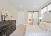 Thumbnail 32 of 81 - Bedroom with a large bed and a dresser at Four23/Hoge, Cincinnati, Ohio