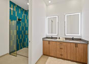 Thumbnail 39 of 81 - Bathroom with two sinks and a shower with a glass door at Four23/Hoge, Cincinnati, OH, 45226