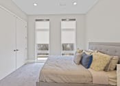 Thumbnail 31 of 81 - Bedroom with a large bed and three windows at Four23/Hoge, Cincinnati, 45226