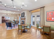 Thumbnail 38 of 54 - a living room with tables and chairs and a fireplace at Indian Creek Apartments*, Ohio, 45236