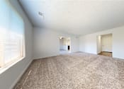 Thumbnail 16 of 35 - a bedroom with a large window and a carpeted floor  at Lawrence Landing, Indianapolis, Indiana
