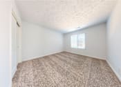 Thumbnail 15 of 35 - a bedroom with white walls and carpet at Lawrence Landing, Indianapolis, 46226