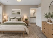 Thumbnail 16 of 40 - A bedroom with a large bed and a painting on the wall.