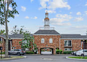 Thumbnail 22 of 32 - a brick church with a steeple and cars parked in front at Olde Towne in Kenwood, Cincinnati, 45243