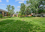 Thumbnail 26 of 32 - our apartments at the district feature a spacious yard and green grass at Olde Towne in Kenwood, Cincinnati, OH