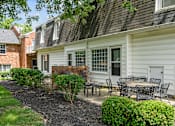 Thumbnail 30 of 32 - a patio with tables and chairs in front of a house at Olde Towne in Kenwood, Cincinnati