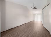 Thumbnail 25 of 32 - a room with white walls and wood floors and a ceiling fan at Parkside at Maple Canyon Apartments, Ohio, 43229