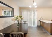 Thumbnail 15 of 32 - a dining room with a table and chairs and a kitchen  at Parkside at Maple Canyon Apartments, Ohio