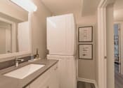 Thumbnail 18 of 33 - A bathroom with a sink and a mirror at A62 Apartments, Indianapolis