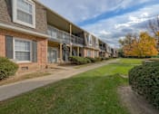 Thumbnail 23 of 33 - A row of apartment buildings with a sidewalk in front at A62 Apartments, Indianapolis 46220