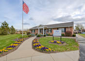 Thumbnail 24 of 33 - A building with an American flag in front of it at A62 Apartments, Indianapolis, Indiana