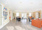 Thumbnail 26 of 33 - A reception area with a desk and chairs at A62 Apartments, Indiana