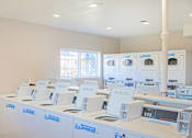 Thumbnail 30 of 33 - A row of white medical devices are lined up on a table at A62 Apartments, Indianapolis, Indiana